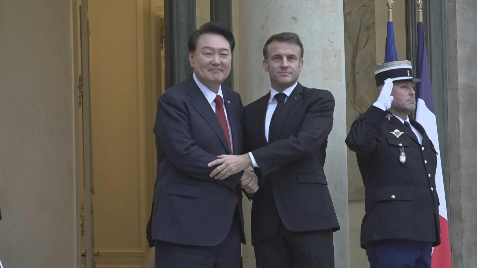 French President Macron greets South Korean counterpart Yoon in Paris