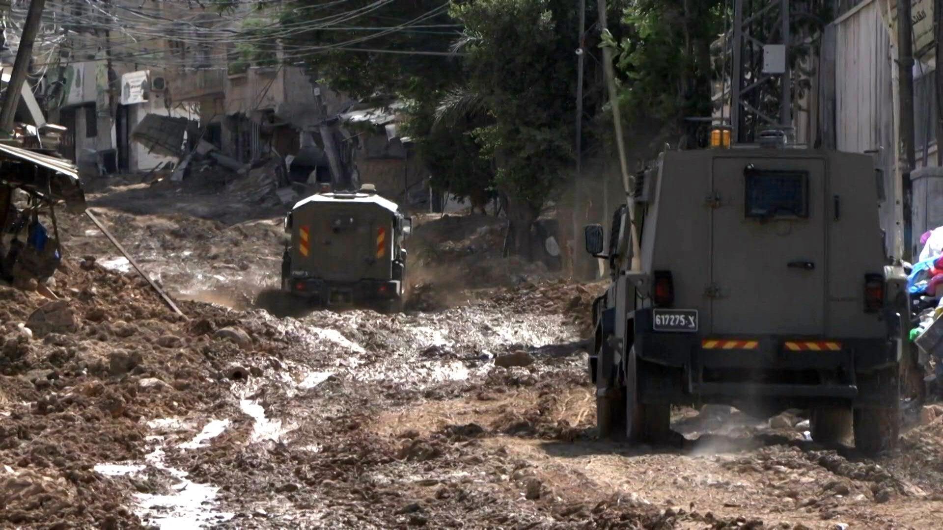 Israeli army vehicles manoeuver in streets of Tulkarem during raid