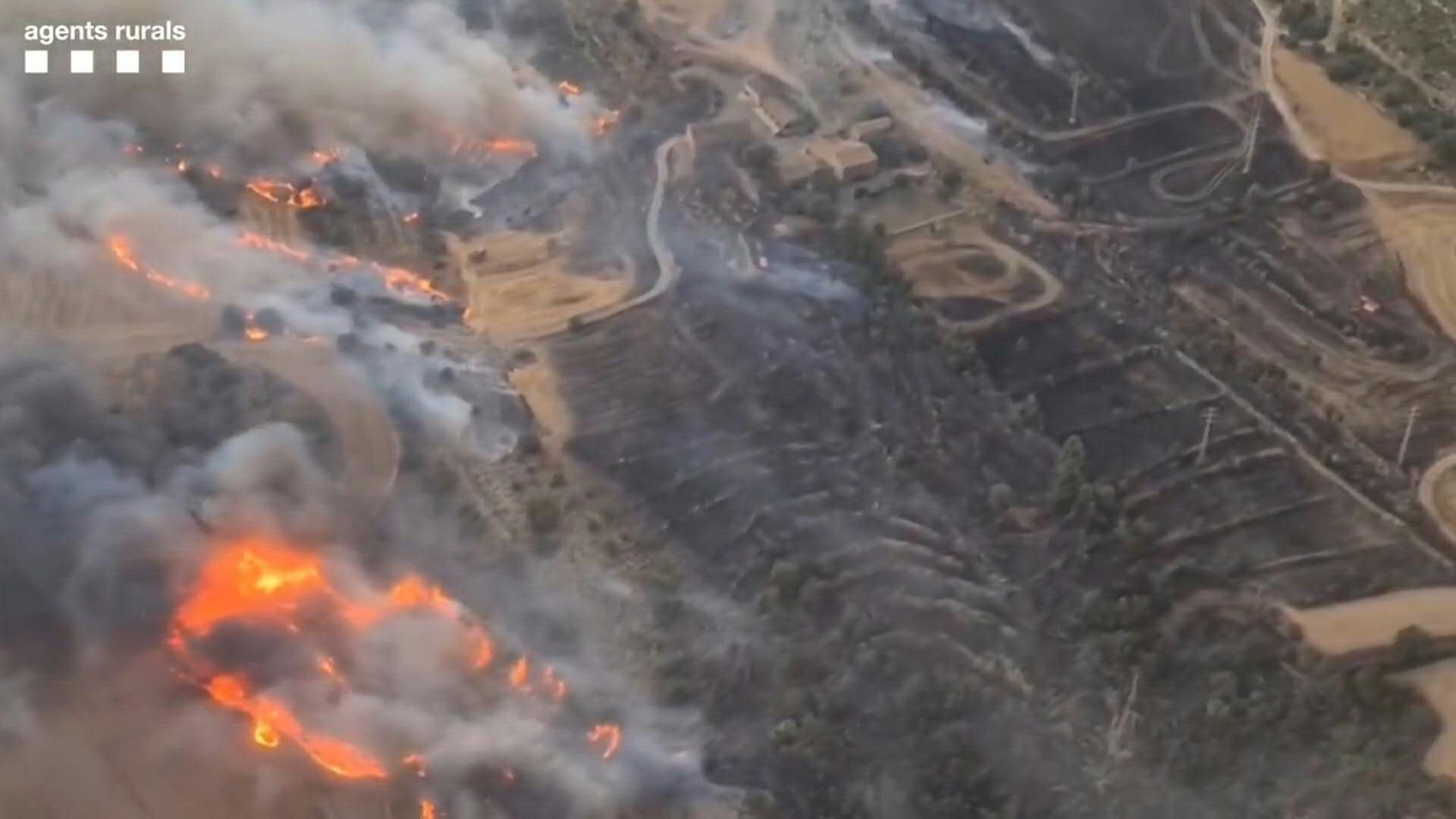 Wildfire killing two rages in Spain