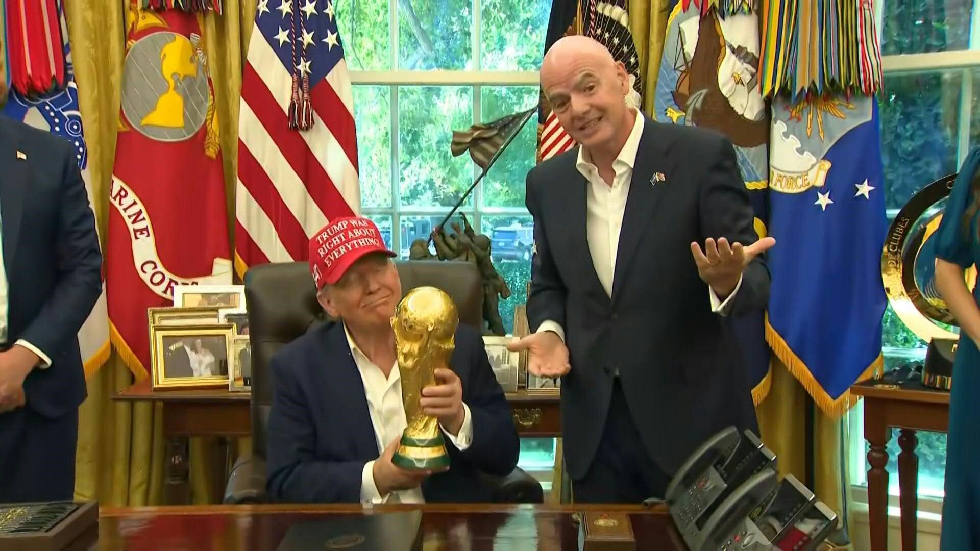 Trump holds World Cup trophy as 2026 draw set for US capital