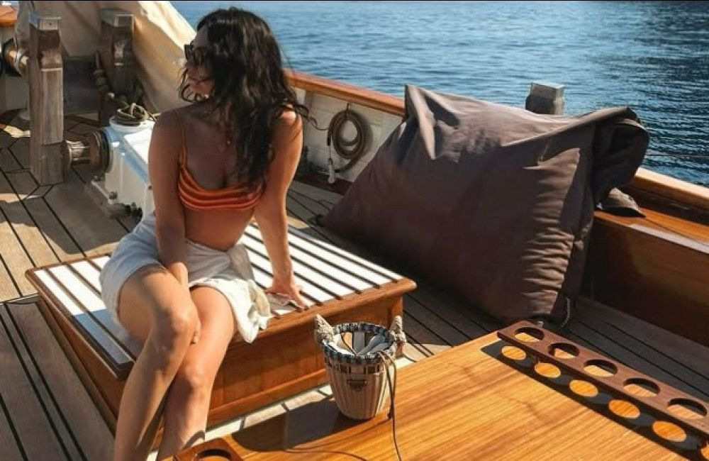 Lily James soaks up the sun in stunning pink bikini