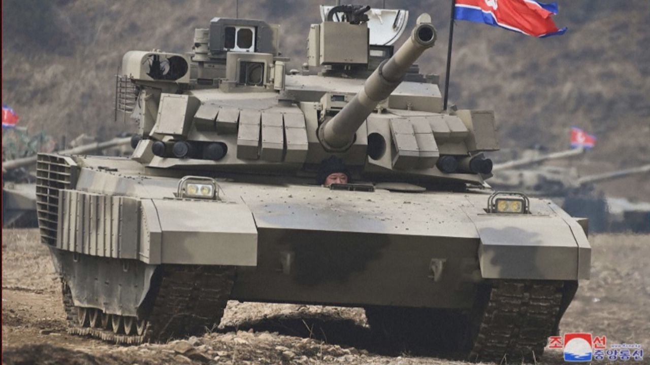 Kim drives new battle tank: North Korea's dictator visits military exercise