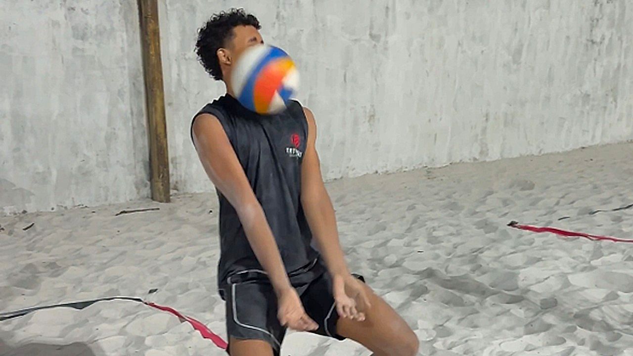 Man accidentally takes volleyball to the face while filming