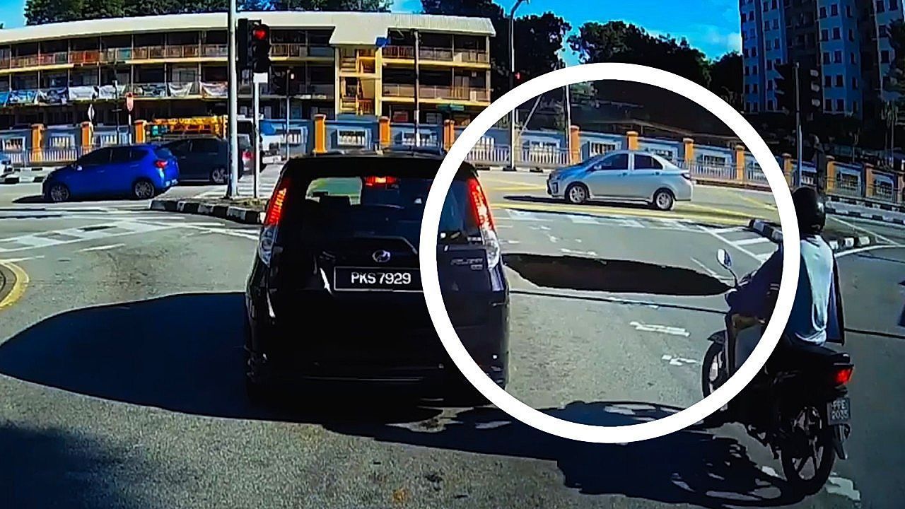 Sinkhole suddenly opens beside car in Malaysia