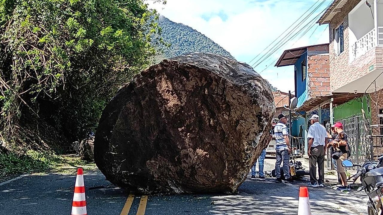 Video: Christmas miracle as quick-thinking biker dodges giant boulder as it crushes his motorbike