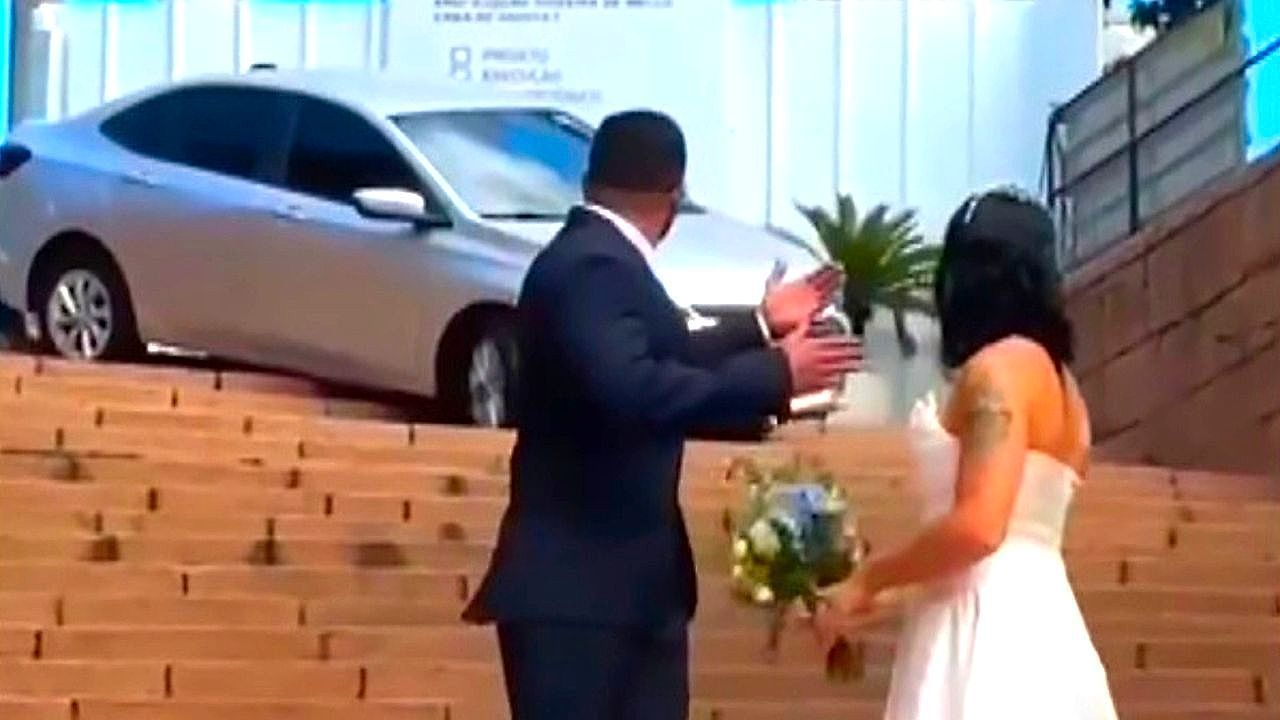 Video: Wedding shoot halted as car bumps down cathedral steps