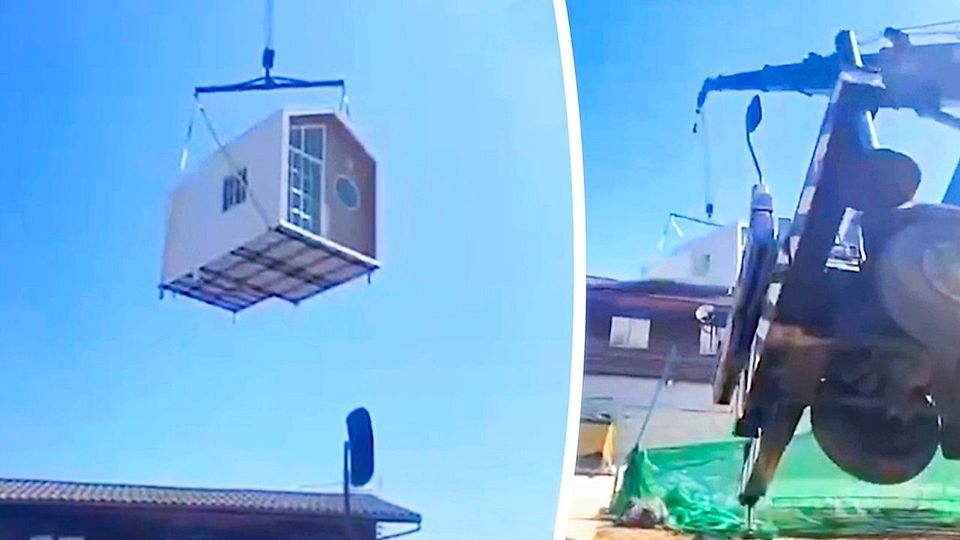 Kran kippt um: Fertighaus kracht auf Wohnhaus