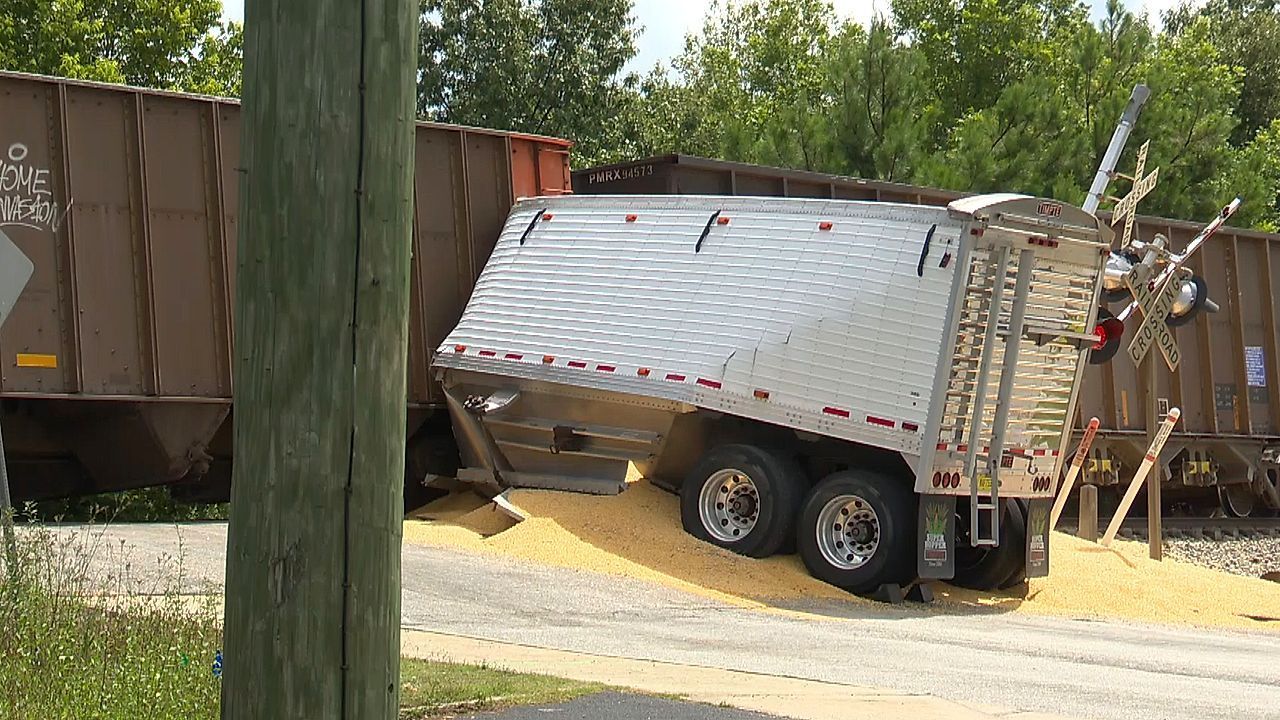 Crash with warning: Train splits semi-truck at railroad crossing in Georgia