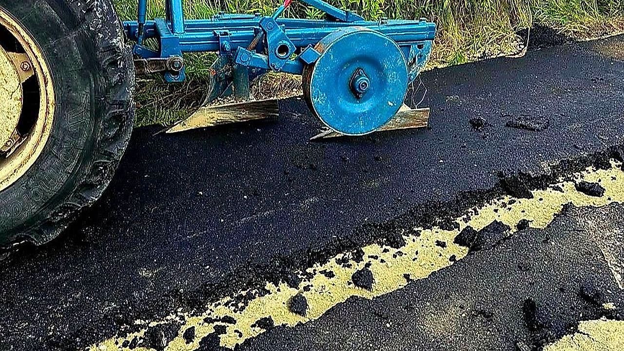 Video: Furious farmer ploughs through freshly laid road with tractor claiming he owned it