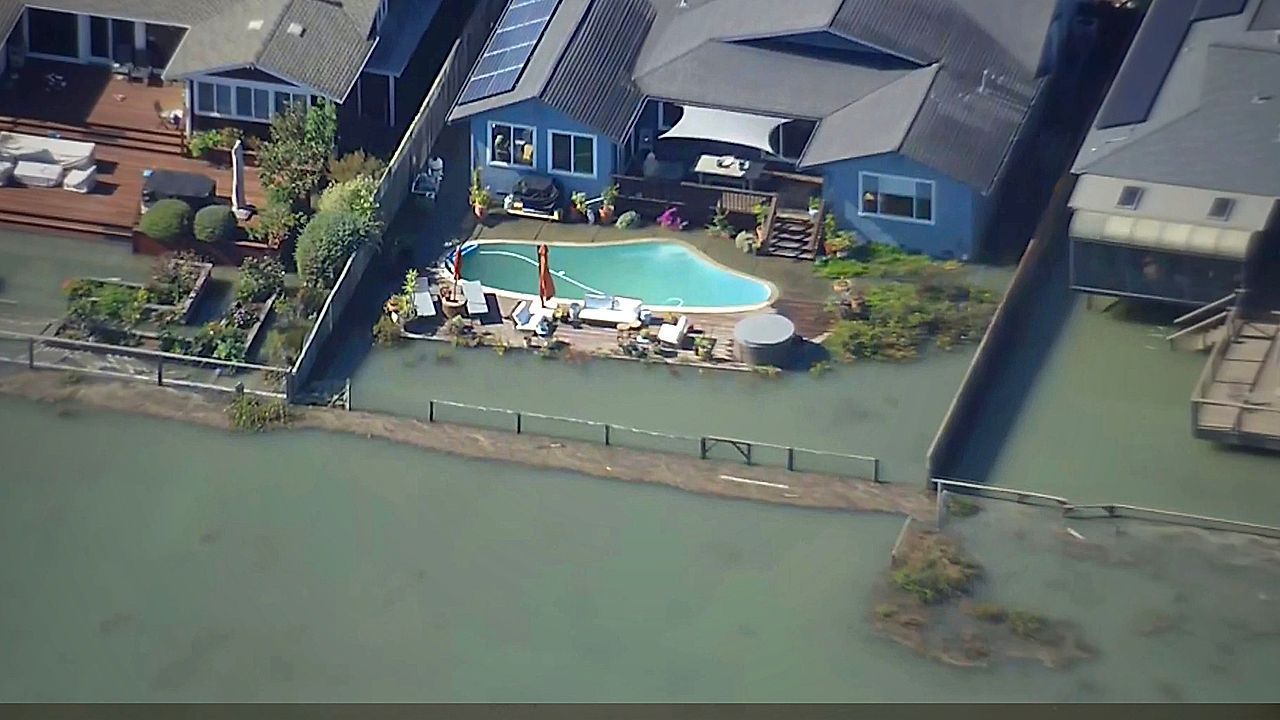 Aerial footage shows record tides flooding a California neighborhood